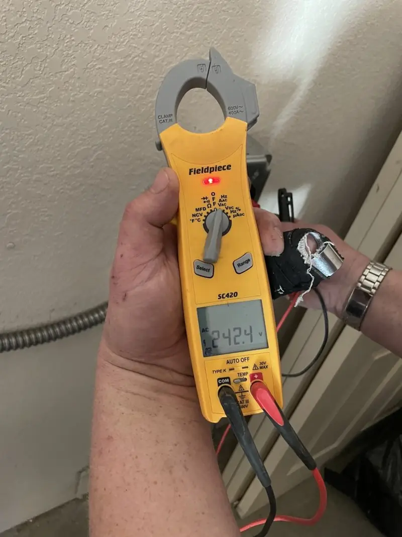 Voltage testing with clamp meter during Recessed Lighting Installation in Davidson